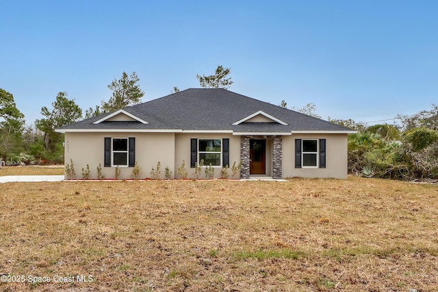 ranch-style home featuring a front lawn