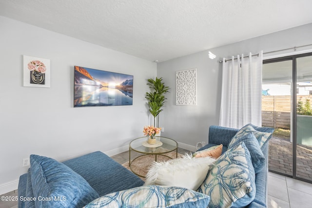 tiled living room with a textured ceiling