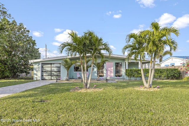 single story home with a garage and a front lawn