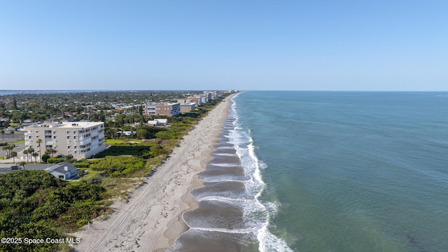 aerial view featuring a water view and a beach view