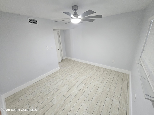 spare room featuring ceiling fan and light wood-type flooring