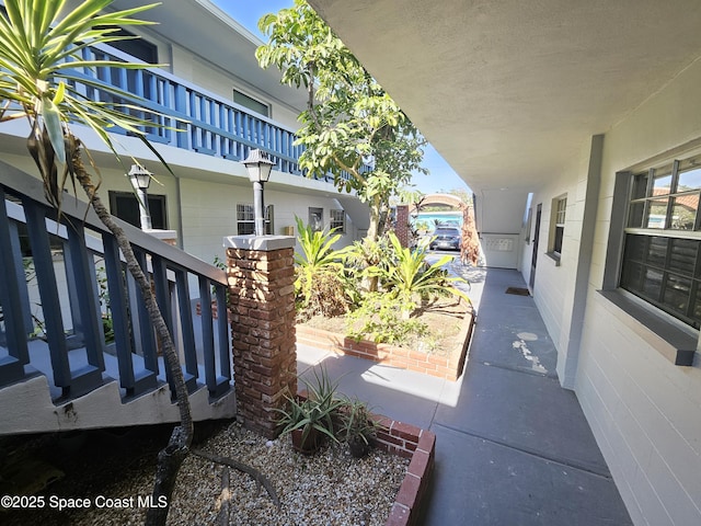 view of patio featuring a balcony