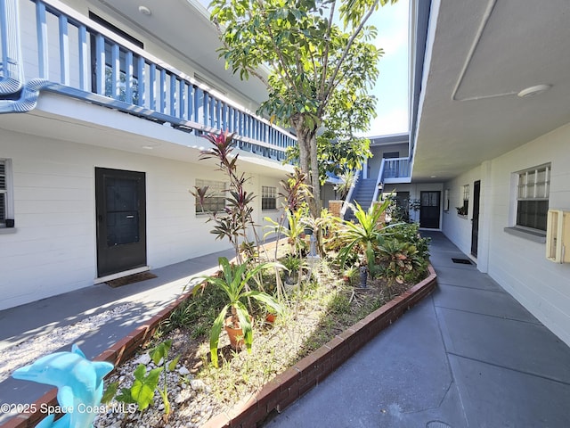 view of patio featuring a balcony