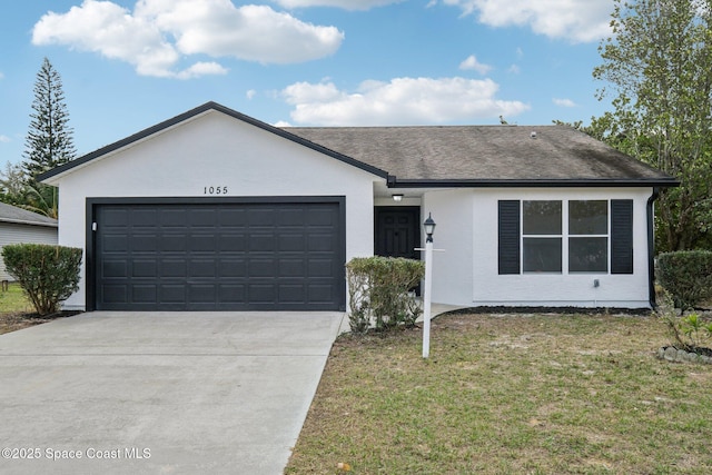 single story home with a garage and a front yard