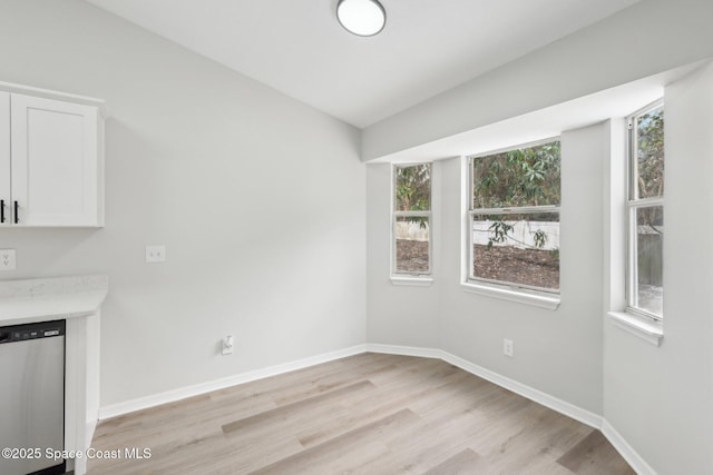 unfurnished dining area featuring light hardwood / wood-style flooring