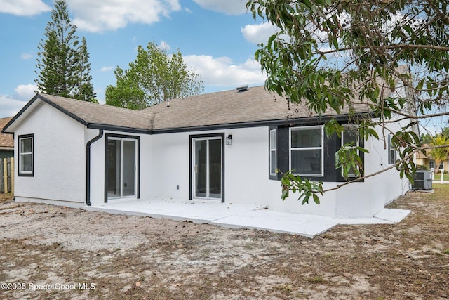 back of property featuring central AC unit and a patio