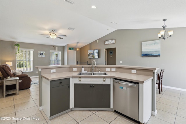 kitchen featuring pendant lighting, sink, light tile patterned floors, an island with sink, and stainless steel dishwasher