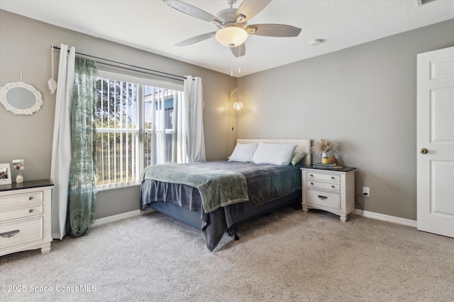 bedroom with ceiling fan and light colored carpet