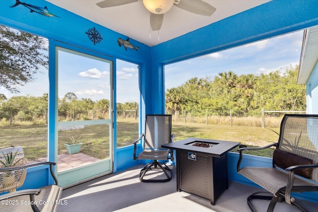 sunroom / solarium with ceiling fan