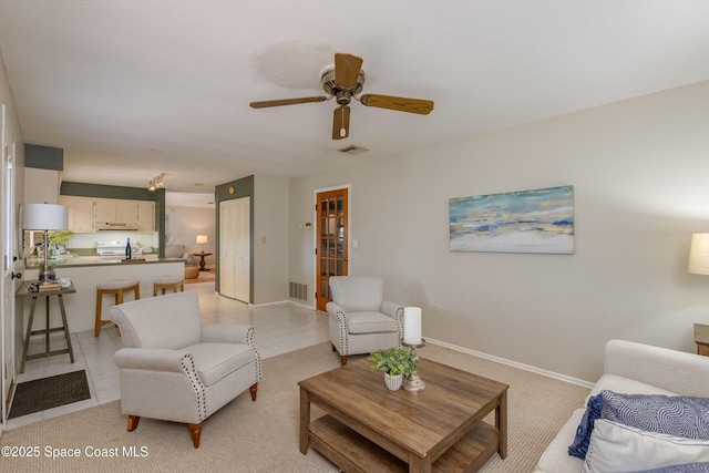 living room featuring ceiling fan