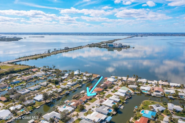 birds eye view of property featuring a water view