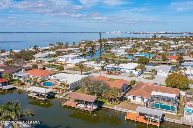 birds eye view of property featuring a water view