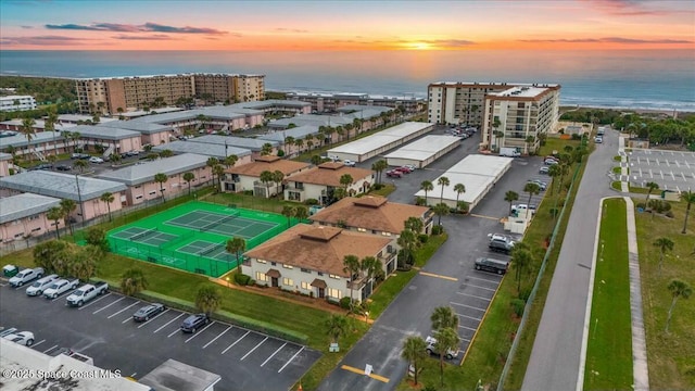 aerial view at dusk with a water view