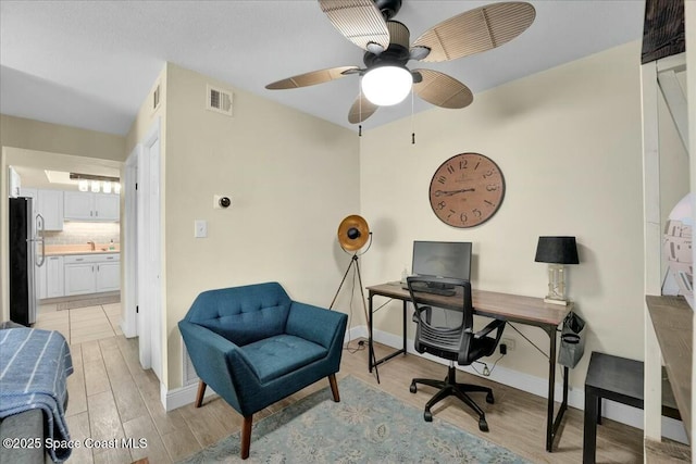 home office featuring light hardwood / wood-style floors