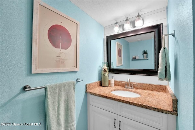 bathroom featuring vanity and a textured ceiling