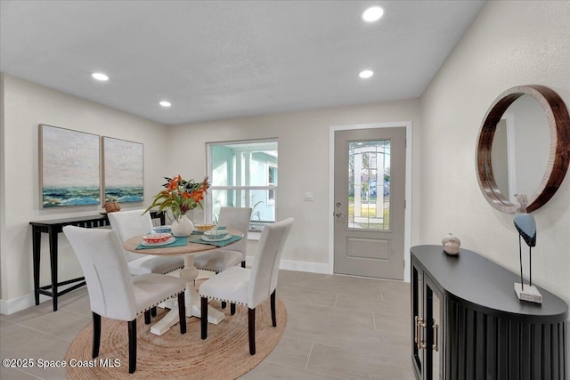 dining space with light tile patterned floors