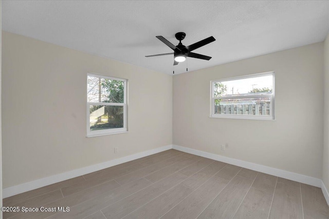 spare room with ceiling fan