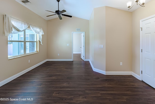 foyer entrance with dark wood-type flooring, ceiling fan, and vaulted ceiling