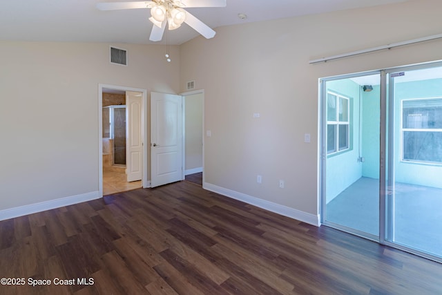 unfurnished bedroom with lofted ceiling, dark wood-type flooring, and ceiling fan