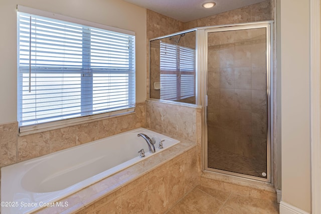 bathroom with plus walk in shower and tile patterned flooring