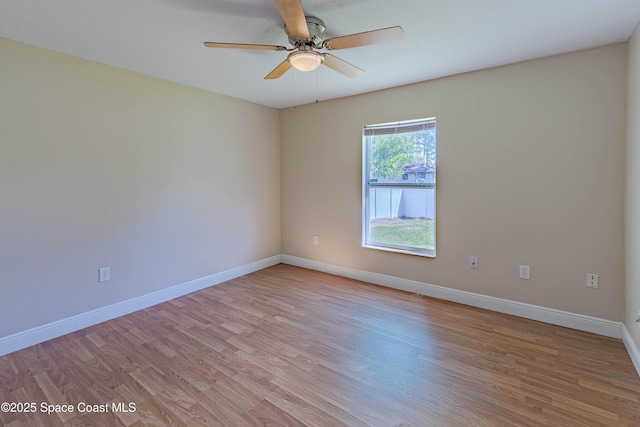 empty room with ceiling fan and light wood-type flooring