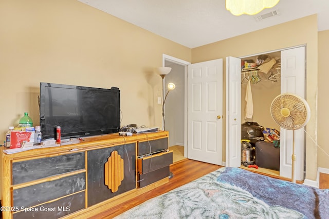 bedroom with hardwood / wood-style flooring