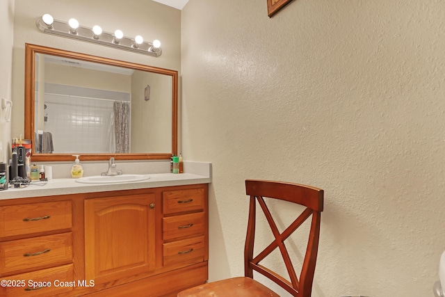 bathroom with vanity and a shower with shower curtain