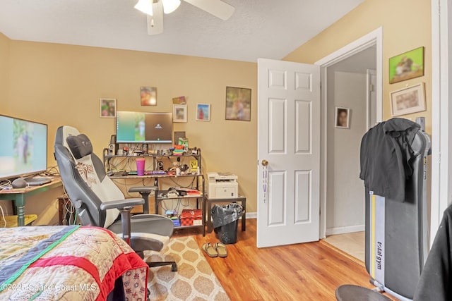 bedroom featuring light hardwood / wood-style flooring and ceiling fan