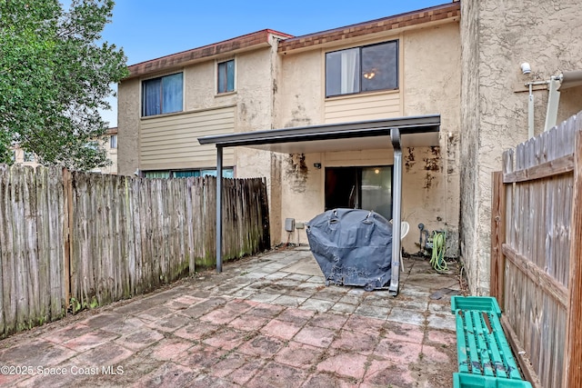 rear view of house featuring a patio