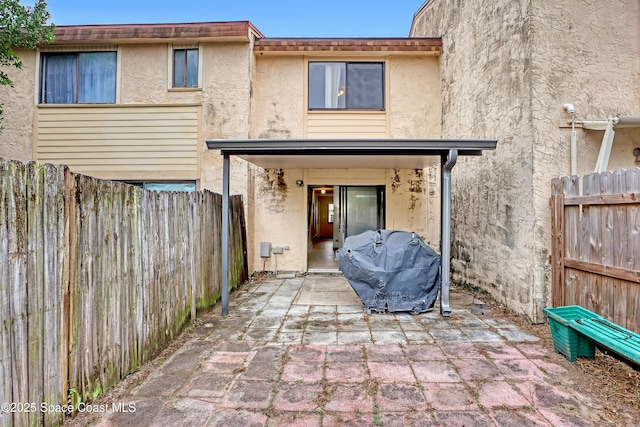 rear view of house with a patio area