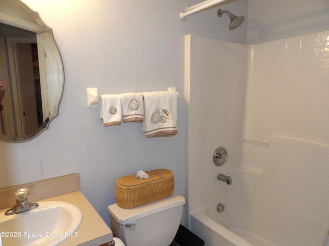 full bathroom featuring vanity, shower / bathtub combination, and toilet