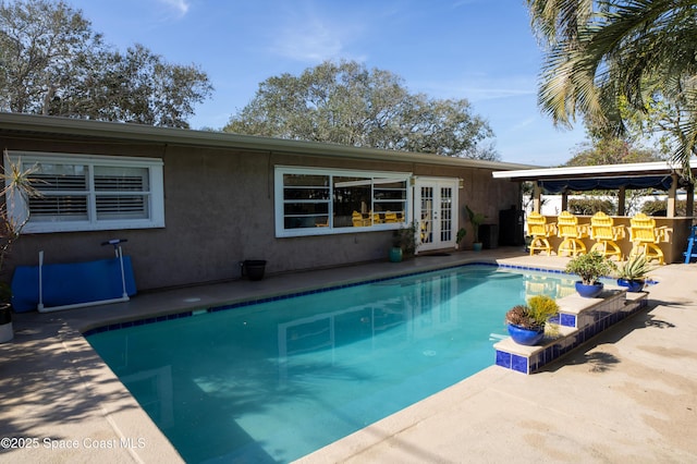 661 Java Rd, Cocoa Beach, FL 32931 - view of pool with a patio, exterior bar, and french doors