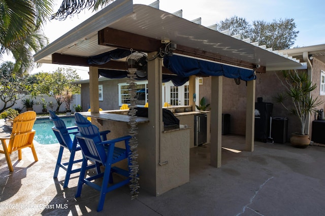 661 Java Rd, Cocoa Beach, FL 32931 - view of patio / terrace with a fenced in pool and exterior bar