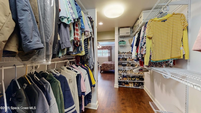 661 Java Rd, Cocoa Beach, FL 32931 - spacious closet with a wall mounted air conditioner and dark hardwood / wood-style flooring