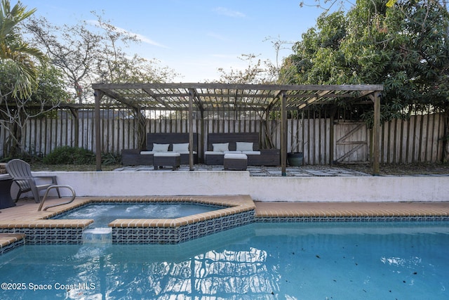 view of pool with outdoor lounge area and an in ground hot tub