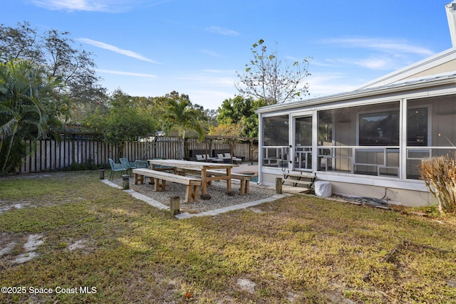 view of yard featuring a sunroom