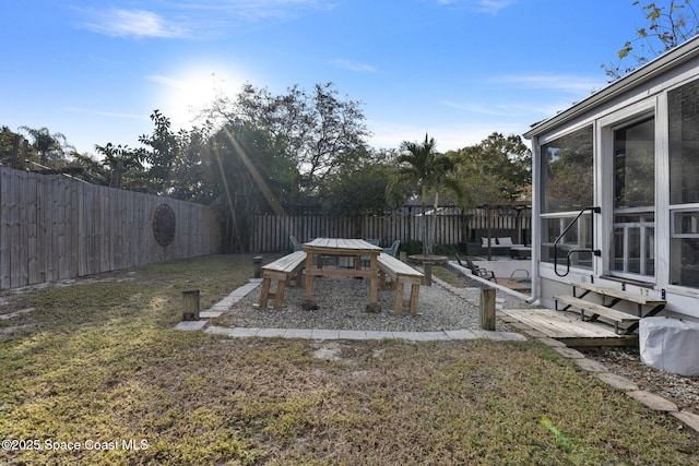 view of yard featuring a sunroom