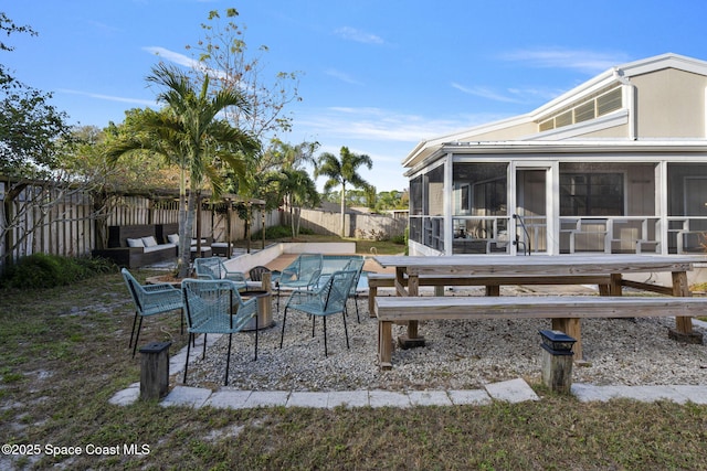 view of patio / terrace with a sunroom