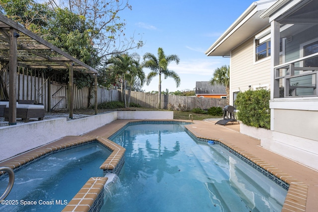 view of pool with an in ground hot tub