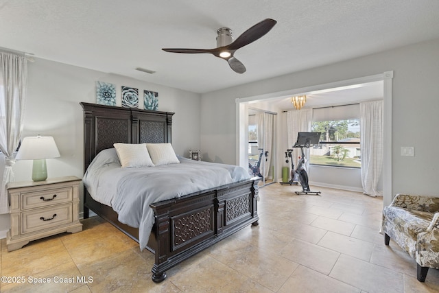 bedroom featuring a textured ceiling and ceiling fan