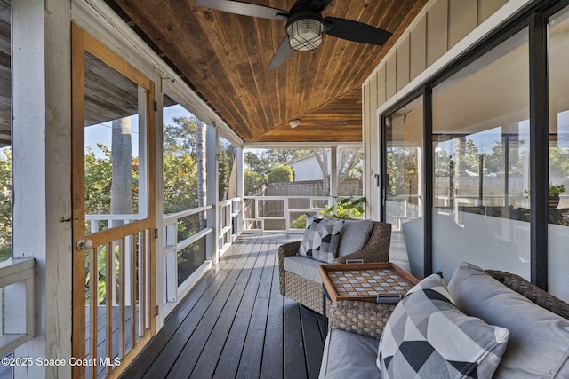 sunroom with lofted ceiling, a wealth of natural light, and wooden ceiling