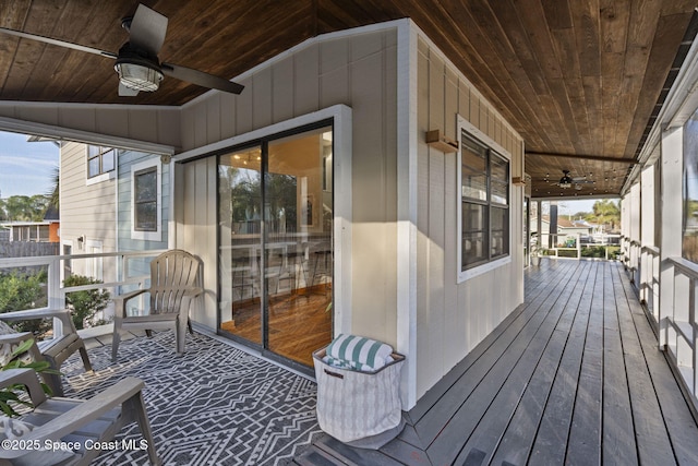 wooden terrace featuring ceiling fan and covered porch