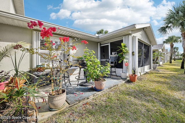 exterior space featuring a patio and a yard