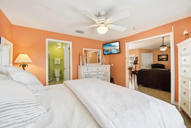 bedroom with ceiling fan and ensuite bathroom