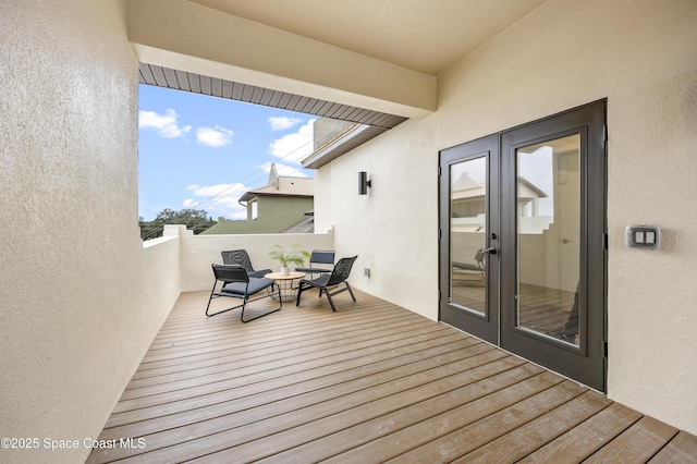 wooden deck featuring french doors