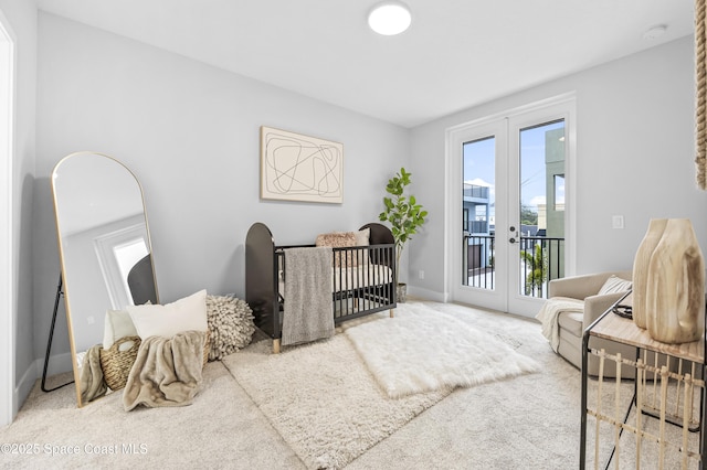 sitting room with french doors and carpet floors