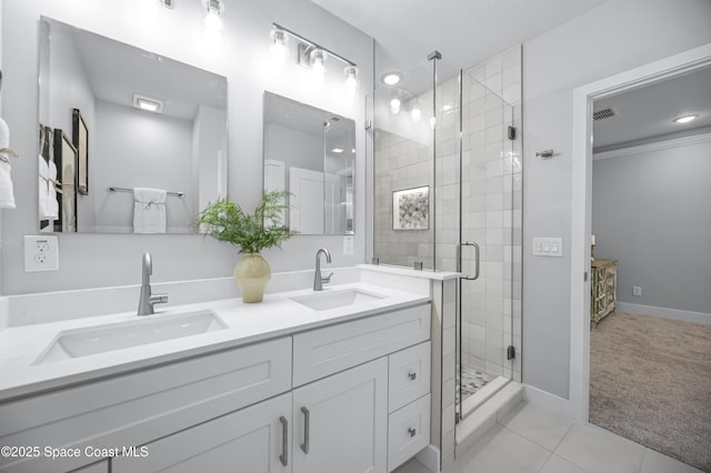 bathroom with walk in shower, tile patterned floors, and vanity