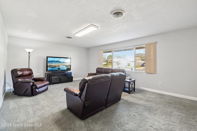 carpeted living room with a textured ceiling