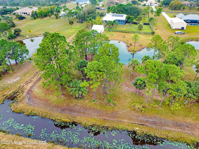 bird's eye view featuring a rural view and a water view