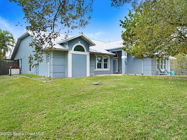 ranch-style home featuring a front yard